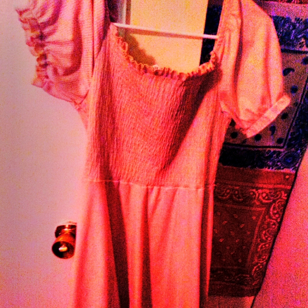 A pretty pink off the shoulder dress